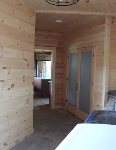 A kitchen in a log cabin.