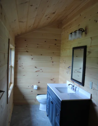 A bathroom with a toilet and sink.