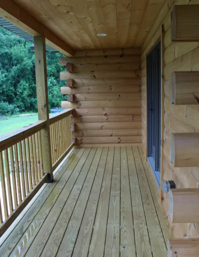 A wooden deck with a railing.